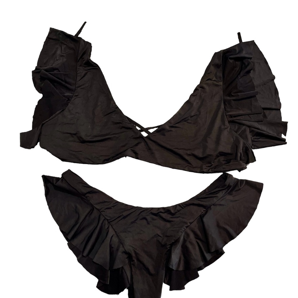 Riot swim black bikini. Cheeky bottoms. Love the ruffle & material.